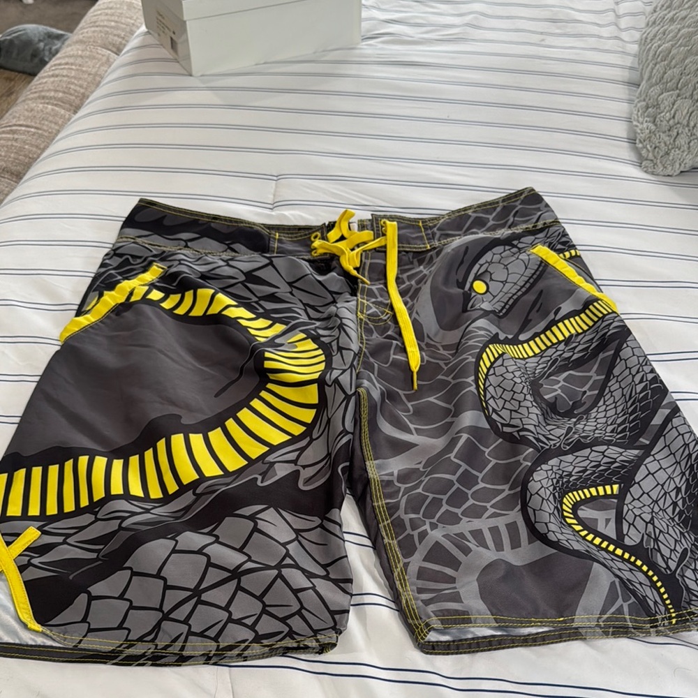 Dynamic Gray and Yellow Board Shorts with Bold Design